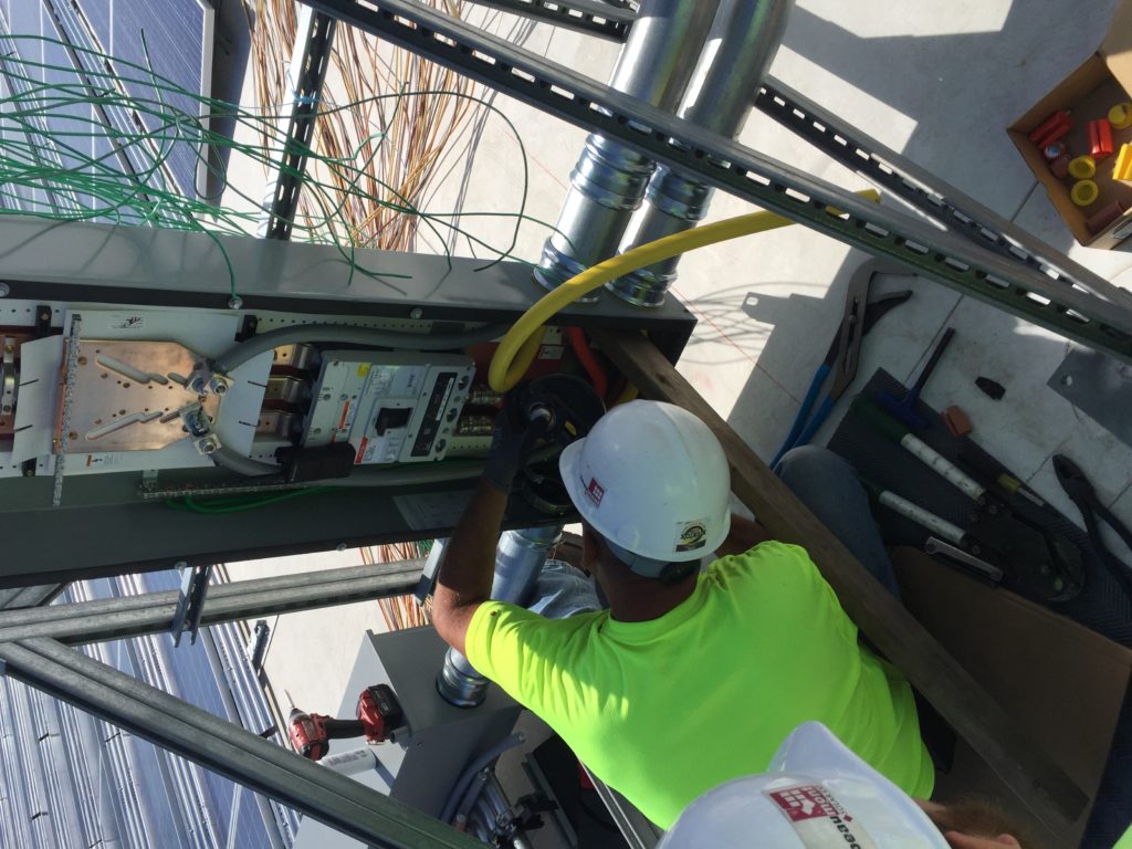Making the main electrical breaker connections.