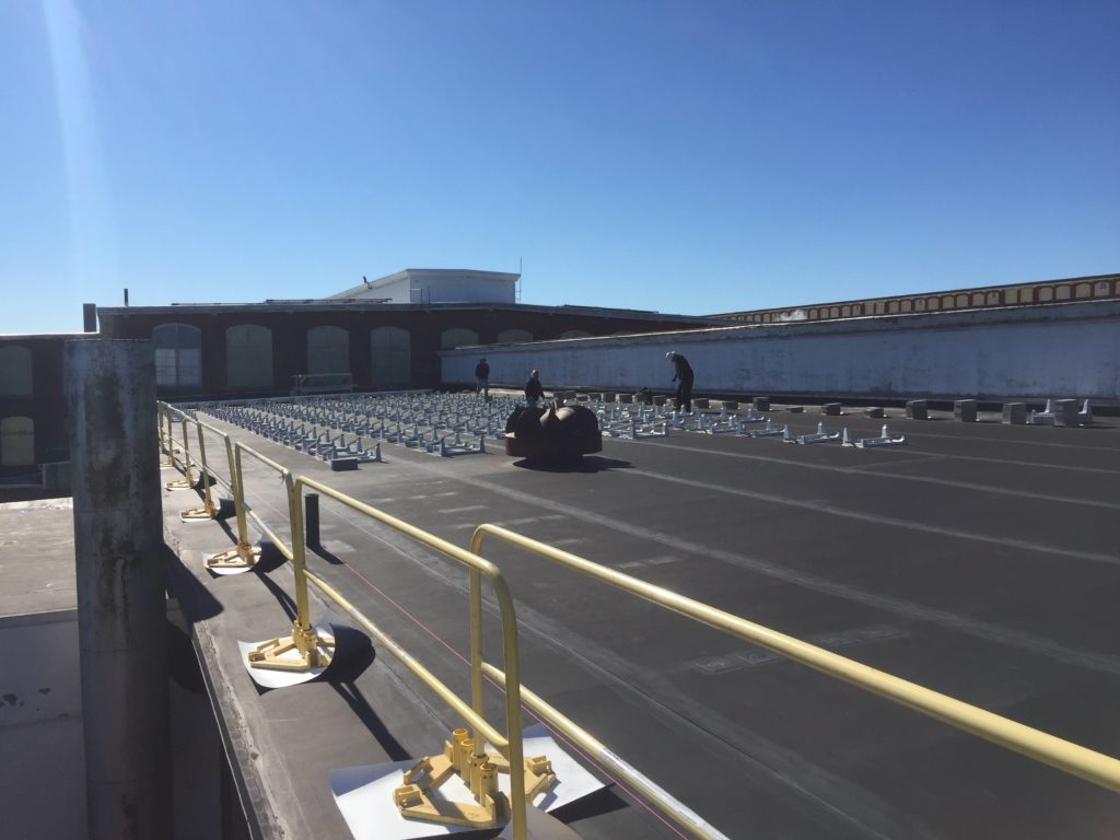 The safety rails have been installed so now the Beaumont Solar installation team begins assembling the solar racking that will hold the solar panels.